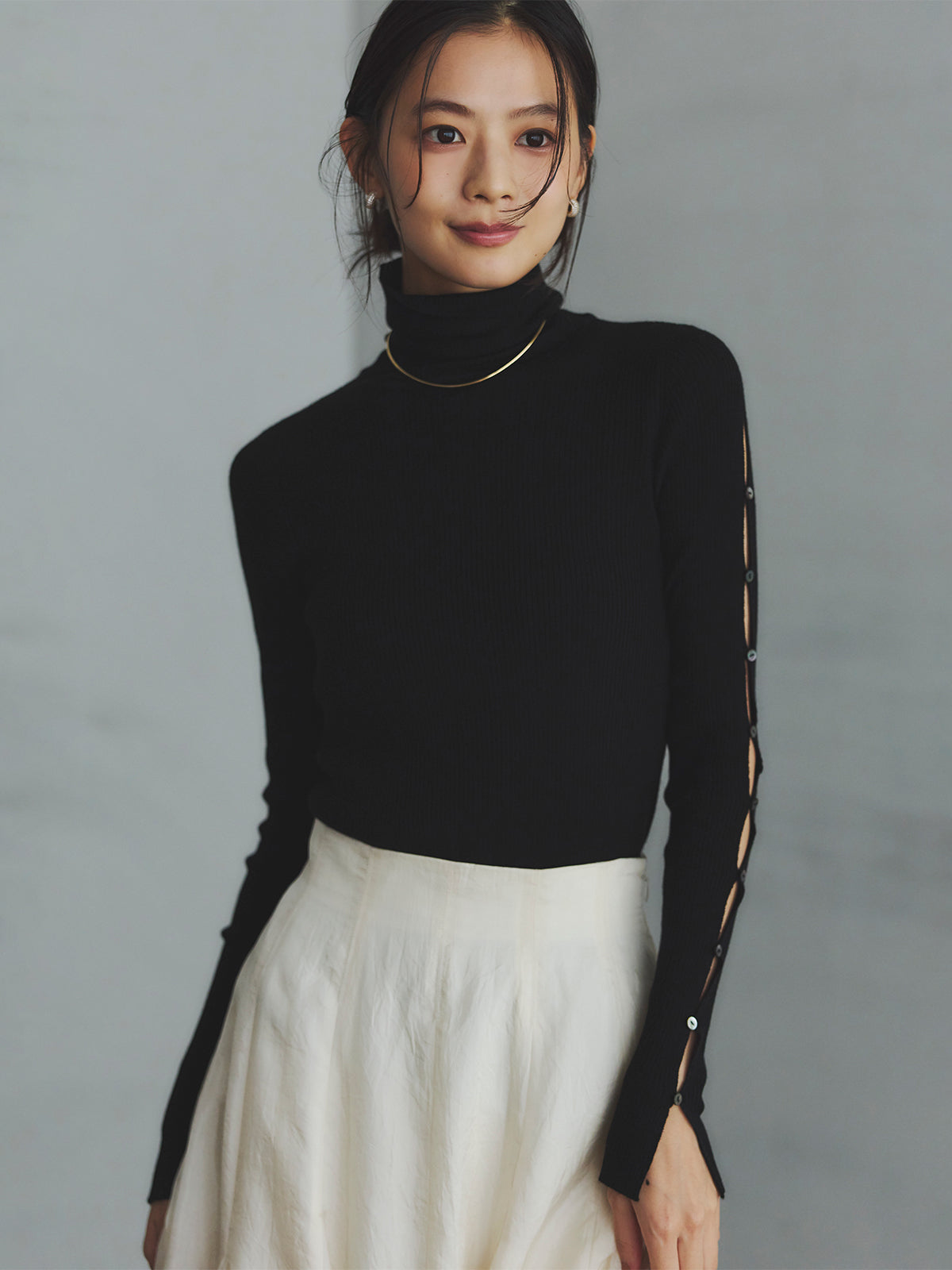 スラッシュリブニットトップス